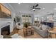 Open-concept living room with fireplace, large windows, and stylish furnishings at 262 Hook Dr # 12, Fuquay Varina, NC 27526