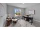 Bright home office with a large window, desk, and comfortable seating area at 262 Hook Dr # 12, Fuquay Varina, NC 27526