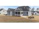 Well-maintained backyard features a concrete patio and blue siding at 262 Hook Dr # 12, Fuquay Varina, NC 27526