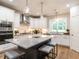 Modern kitchen with stainless steel appliances, large island and pendant lighting at 100 Old Garden Ln, Youngsville, NC 27596