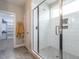 Modern bathroom highlighting a glass-enclosed shower with white subway tile and built-in shelving at 100 Old Garden Ln, Youngsville, NC 27596