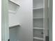 Bright walk-in closet with shelving and hanging rods, offering convenient storage solutions at 100 Old Garden Ln, Youngsville, NC 27596