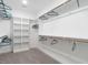 Spacious walk-in closet with custom shelving and ample hanging space for organized storage at 100 Old Garden Ln, Youngsville, NC 27596