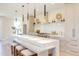 Contemporary kitchen featuring a large island, modern appliances, and stylish pendant lighting at 600 N Roxboro St # 22, Durham, NC 27701