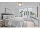 Bright bedroom featuring large windows and a modern aesthetic at 2 Seawell Ave # 101, Raleigh, NC 27601