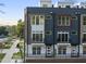 Contemporary townhome exterior with multiple floors, balconies, and manicured landscaping at 2 Seawell Ave # 101, Raleigh, NC 27601