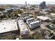 Aerial view of new modern townhomes with the city skyline in the background at 2014 Moody Ln, Durham, NC 27701