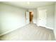 Bright bedroom with neutral carpet and walk-in closet, ready for personalization at 152 Southern Estates Dr, Sanford, NC 27330