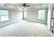 Spacious bedroom featuring plush carpet, recessed lighting, and tray ceiling with ceiling fan at 152 Southern Estates Dr, Sanford, NC 27330