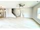 Open-concept living room featuring hardwood floors, a ceiling fan, and a staircase at 152 Southern Estates Dr, Sanford, NC 27330