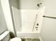 Bathroom featuring a standard shower/tub combination with chrome fixtures and a standard toilet at 303 Bishop Ln, Sanford, NC 27330