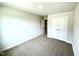 Well-lit bedroom with neutral walls, plush carpet and double-door closet at 303 Bishop Ln, Sanford, NC 27330