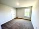Bedroom with a window for natural light and closet with double doors at 303 Bishop Ln, Sanford, NC 27330