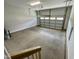 Empty two car garage with a garage door with clear glass panels in the top row at 303 Bishop Ln, Sanford, NC 27330