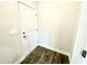 Hallway with hardwood floors and access to a door at 303 Bishop Ln, Sanford, NC 27330