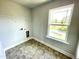 Functional laundry room with tile flooring, and hookups for appliances at 303 Bishop Ln, Sanford, NC 27330
