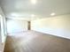 Spacious living area showcasing neutral walls, plush carpeting, and recessed lighting at 303 Bishop Ln, Sanford, NC 27330