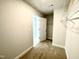 Spacious walk-in closet with wire shelving, carpeted flooring, and direct access to other rooms at 303 Bishop Ln, Sanford, NC 27330