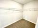 Empty walk-in closet offers great storage and organization space at 303 Bishop Ln, Sanford, NC 27330