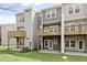 Exterior view of a multilevel deck and patio with manicured lawn at 125 Sugar Run Dr # 26, Fuquay Varina, NC 27526