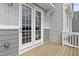 Exterior image of a wood balcony with gray siding and white trim at 125 Sugar Run Dr # 26, Fuquay Varina, NC 27526