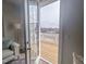 View from an open glass door to a wooden balcony overlooking the water at 125 Sugar Run Dr # 26, Fuquay Varina, NC 27526