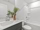 Bright bathroom features a sleek vanity with a white countertop, a tub and shower combination at 125 Sugar Run Dr # 26, Fuquay Varina, NC 27526