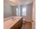 Bathroom with a vanity, toilet, and large mirror at 125 Sugar Run Dr # 26, Fuquay Varina, NC 27526