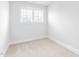 Bright bedroom with neutral walls and plush carpet. Natural light floods the space through a window at 125 Sugar Run Dr # 26, Fuquay Varina, NC 27526