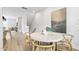 Cozy dining area features a round table, woven chairs, and a modern art piece at 125 Sugar Run Dr # 26, Fuquay Varina, NC 27526