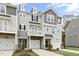 Beautiful townhomes with craftsman-style architectural elements and individual garage and balcony at 125 Sugar Run Dr # 26, Fuquay Varina, NC 27526