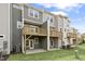 Townhome showcasing a wooden deck and an outdoor patio for relaxing and entertaining at 125 Sugar Run Dr # 26, Fuquay Varina, NC 27526