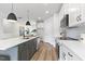 Beautiful kitchen with gray and white cabinets, stainless appliances, and a large island at 125 Sugar Run Dr # 26, Fuquay Varina, NC 27526