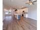 Open floor plan with kitchen island and hardwood floors at 125 Sugar Run Dr # 26, Fuquay Varina, NC 27526