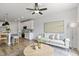 Bright living room open to the kitchen featuring modern decor and wood-look flooring at 125 Sugar Run Dr # 26, Fuquay Varina, NC 27526