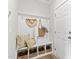 A useful mudroom with a coat rack and cubbies adds storage near the home's entryway at 125 Sugar Run Dr # 26, Fuquay Varina, NC 27526