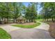 Park gazebo with brick pathways and lush green landscape at 125 Sugar Run Dr # 26, Fuquay Varina, NC 27526