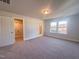 Spacious bedroom with carpet, walk-in closet, and bathroom access at 127 Sugar Run Dr # 27, Fuquay Varina, NC 27526