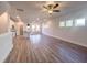 Spacious living room with hardwood floors and kitchen view at 127 Sugar Run Dr # 27, Fuquay Varina, NC 27526