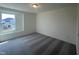Inviting bedroom featuring plush carpeting and bright natural light from the window at 323 Chestnut Oak Ln, Lillington, NC 27546