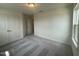 Bedroom featuring plush carpeting, a closet, and bright natural light at 323 Chestnut Oak Ln, Lillington, NC 27546