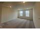 Bedroom featuring plush carpeting, recessed lighting, and windows offering natural light at 323 Chestnut Oak Ln, Lillington, NC 27546