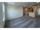 Spacious loft area with carpeting and ample natural light from the windows at 323 Chestnut Oak Ln, Lillington, NC 27546