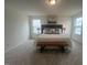 Relaxing main bedroom with a plush bed, stylish decor, and ample natural light at 323 Chestnut Oak Ln, Lillington, NC 27546
