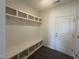 Mudroom with built-in bench, hooks and shelves, perfect for organization at 323 Chestnut Oak Ln, Lillington, NC 27546