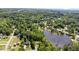 Beautiful aerial view of lakeside neighborhood with lots of mature trees at 3309 Westcott Cir, Sanford, NC 27330