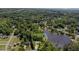 Stunning aerial view of home nestled among lush trees, showcasing its proximity to the lake at 3309 Westcott Cir, Sanford, NC 27330