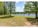 Lush green backyard with a view of the lake at 3309 Westcott Cir, Sanford, NC 27330