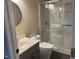 Bathroom featuring walk-in shower with glass doors and single vanity at 3309 Westcott Cir, Sanford, NC 27330