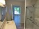 Modern bathroom featuring a glass enclosed shower, bright vanity, and updated fixtures at 3309 Westcott Cir, Sanford, NC 27330